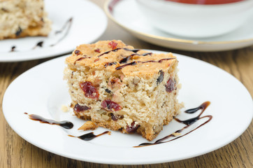 piece of cake with dried cranberries and nuts