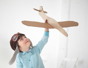 happy boy play in airplane  indoors