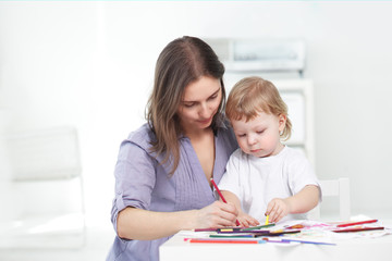 Fototapeta premium mother and son paint indoors