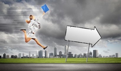 Businesswoman running on the road