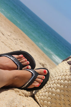 Beach and female feet