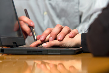 Boss holding hands subordinate