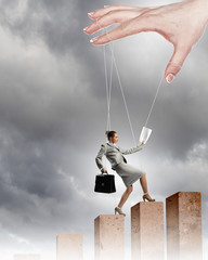 Business woman marionette