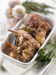 roasted rabbit with herbs and garlic, selective focus