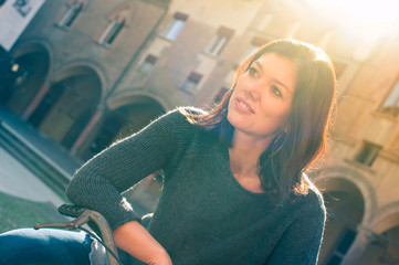 Beautiful woman portrait outdoors with back light.