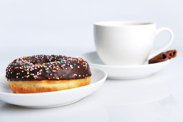 cup of coffee with sweet donut