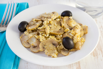 mushrooms with scrambled eggs on the plate