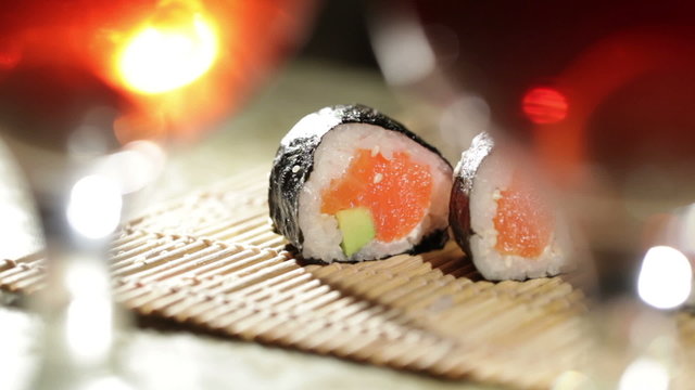 Sushi rolls and plum wine. Beautiful shallow dof.