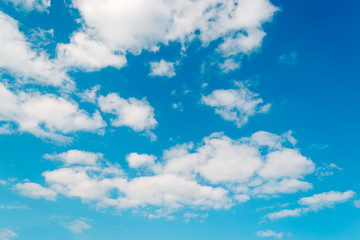 scattered clouds in a blue sky