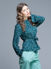 Fototapeta premium cute woman in casual summer outfit posing in the studio