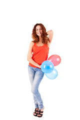 Happy beautiful woman holding balloons