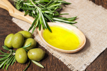 olive oil in a wooden spoon