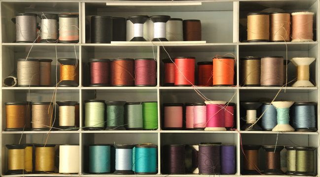colored thread on shelf