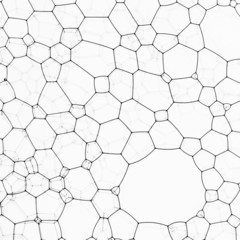Close-up of black ink bubbles against glass