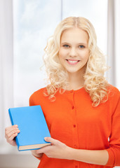 happy and smiling woman with book