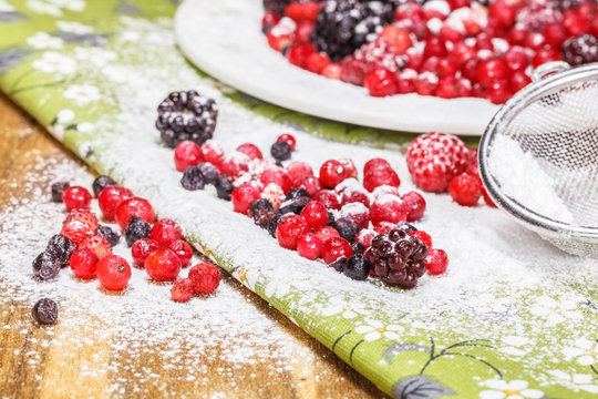 Fresh berries  with powdered sugar