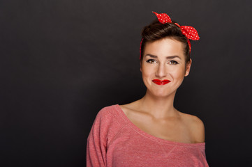 Pin-up woman with big smile on black background