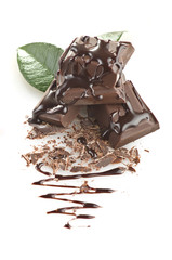 Fototapeta premium close up of chocolate pieces on white background