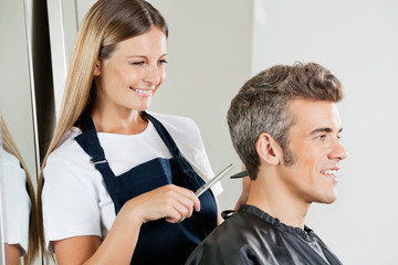 Hairdresser Cutting Customer's Hair
