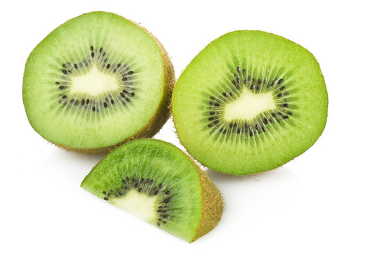  kiwi fruit and his sliced close up on white