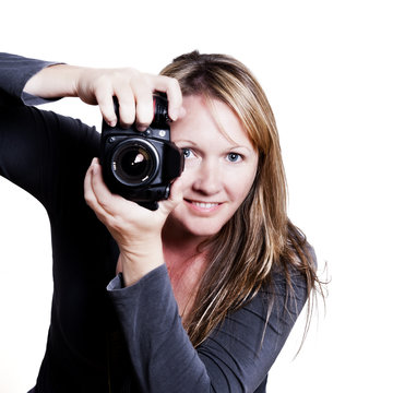 attractive 30something photographer aiming her camera
