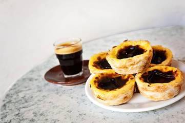 a pile of tarts with espresso