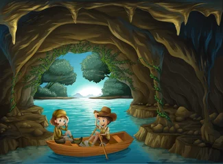  Een grot met twee kinderen die in een houten bootje rijden © GraphicsRF