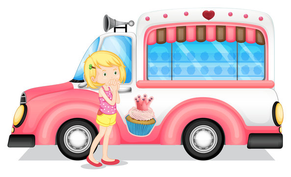 A young girl beside the pink bus