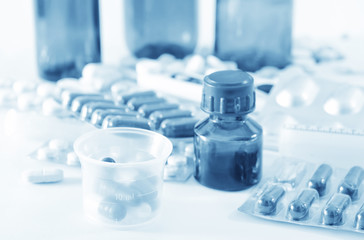 color pills and medical bottle