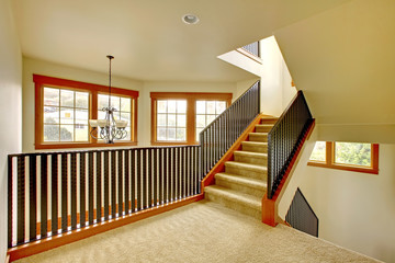 Staircase with metal railing. New luxury home interior.