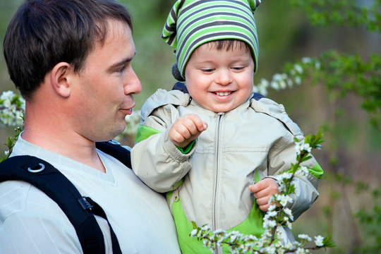 Father And His Little Son Talking Outdoors