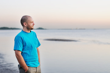 Man standing by the sea