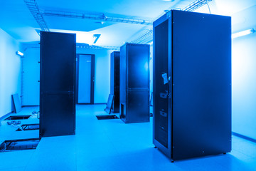 server cabinets inside data center room