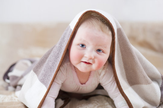 Cute Baby With A Blanket