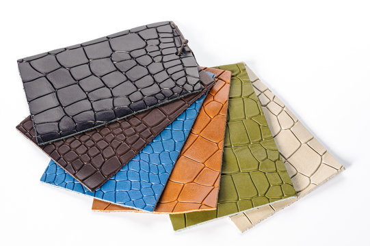 Natural italian leather multicoloured samples on white background.