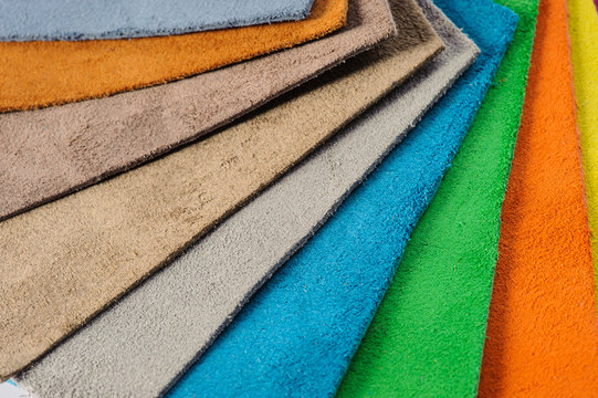 Natural italian leather multicoloured samples on white background.