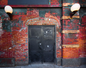 Exterior steel door on brick building exterior
