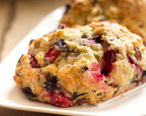 Warm cranberry scones on plate