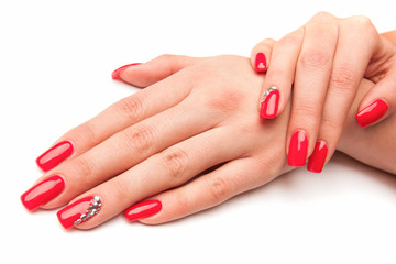 Obraz na płótnie Canvas Beautiful female hands with red nails isolated on white