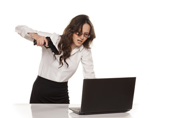 nervous and angry secretary destroys your laptop by using guns