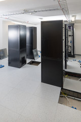 server cabinets inside data center room