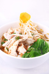 Chicken clear noodle soup with wonton.