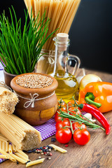 The composition of the pasta and vegetables on background