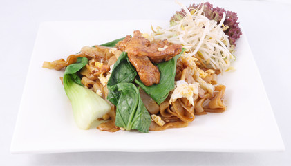 Asian stir fried flat rice noodles. Pad se ew with chicken.