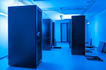 server cabinets inside data center room