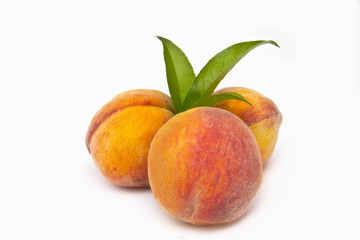Fototapeta na wymiar three peaches on a white background