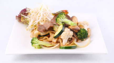 Flat rice noodle stir fried with oyster sauce and vegetable