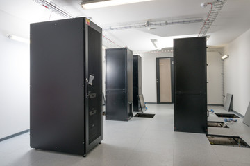 server cabinets inside data center room