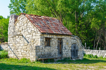 Obraz premium A typical antique Ukrainian country stone house, near Kiev in Ukraine