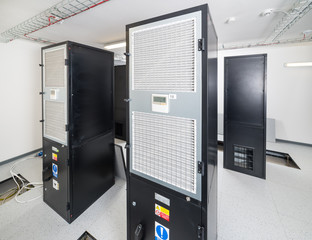 server cabinets inside data center room